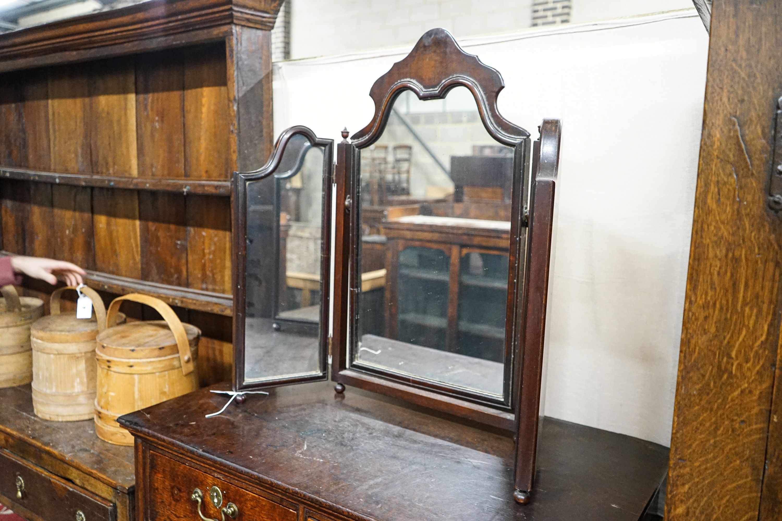 A 1930's walnut triptych dressing table mirror, height 75cm